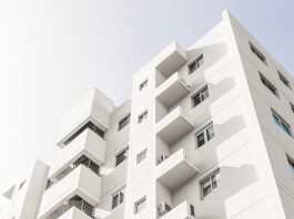 low angle shot facade white modern building blue clear sky